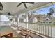 Spacious porch overlooking the neighborhood with wood floors, white railings, and seating at 1300 Carol Oaks Dr, Mount Pleasant, SC 29466