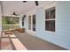 Light blue porch featuring ceiling fans, white railings, and an outdoor seating area at 1300 Carol Oaks Dr, Mount Pleasant, SC 29466