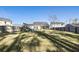Spacious backyard with mature trees, a privacy fence, and a swing set for outdoor enjoyment at 1403 Thin Pine Dr, Johns Island, SC 29455