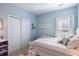 Light-blue bedroom features a bright window, double closet doors, and plush carpet at 1403 Thin Pine Dr, Johns Island, SC 29455