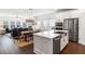 Open-concept kitchen featuring stainless steel appliances, modern countertops, and a seamless flow to the dining area at 1403 Thin Pine Dr, Johns Island, SC 29455