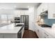 Modern kitchen with white cabinets, stainless steel appliances, and a chic backsplash, offering style and functionality at 1403 Thin Pine Dr, Johns Island, SC 29455