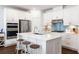 Contemporary kitchen showcasing an island with seating, stainless steel appliances, and white cabinetry for a clean design at 1403 Thin Pine Dr, Johns Island, SC 29455