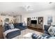Cozy living room with a large entertainment center, plush sofas, and an open-concept layout at 1403 Thin Pine Dr, Johns Island, SC 29455