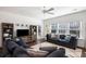 Bright living room with an entertainment center, plush seating, and a neutral color palette at 1403 Thin Pine Dr, Johns Island, SC 29455