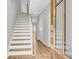 Inviting entryway with hardwood floors, a staircase, and a stylish glass-paneled front door at 151 Cantona Dr, Summerville, SC 29483