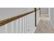 Hallway with wood and white balustrade leading to carpeted stairs and rooms at 151 Cantona Dr, Summerville, SC 29483