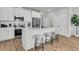 Modern kitchen with stainless steel appliances, white cabinets, and a breakfast bar at 151 Cantona Dr, Summerville, SC 29483