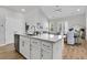 Modern kitchen island with white cabinets, stainless steel appliances, and lots of counter space at 151 Cantona Dr, Summerville, SC 29483