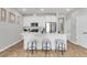 Modern kitchen with stainless steel appliances, white cabinets, and seating at the island at 151 Cantona Dr, Summerville, SC 29483