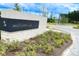 The brick entrance sign, surrounded by lush greenery, welcomes residents to Midtown Club at 1601 Trailmore Ln, Summerville, SC 29486