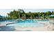 The community pool features multiple lounge areas, umbrellas, and clear water, ideal for leisure and fun at 1601 Trailmore Ln, Summerville, SC 29486