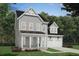 Charming two-story home with gray siding, white trim, and a two-car garage at 1601 Trailmore Ln, Summerville, SC 29486