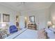 Comfortable bedroom with hardwood floors, a chest of drawers, and access to an ensuite bathroom at 1600 Long Grove Dr # 1621, Mount Pleasant, SC 29464