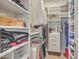Organized walk-in closet featuring custom shelving and ample storage for clothes and accessories at 1600 Long Grove Dr # 1621, Mount Pleasant, SC 29464