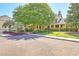 Lovely clubhouse exterior with lush landscaping and American flag shows community pride at 1600 Long Grove Dr # 1621, Mount Pleasant, SC 29464
