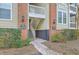 Brick building featuring an inviting entrance with manicured landscaping and charming lighting fixtures at 1600 Long Grove Dr # 1621, Mount Pleasant, SC 29464