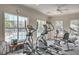 Bright gym with treadmills overlooking the community pool offers a refreshing workout atmosphere at 1600 Long Grove Dr # 1621, Mount Pleasant, SC 29464
