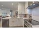 Contemporary kitchen featuring stainless steel appliances, white cabinetry, and a functional layout at 1600 Long Grove Dr # 1621, Mount Pleasant, SC 29464