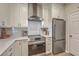 Modern kitchen with stainless steel appliances, white cabinetry, and quartz countertops at 1600 Long Grove Dr # 1621, Mount Pleasant, SC 29464
