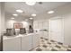 Clean and well-lit community laundry room with modern washers and dryers at 1600 Long Grove Dr # 1621, Mount Pleasant, SC 29464