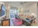 Inviting living room with comfortable seating, neutral tones, and sliding glass doors to the balcony at 1600 Long Grove Dr # 1621, Mount Pleasant, SC 29464