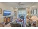 Cozy living room with comfortable seating, neutral tones, and sliding glass doors to the balcony at 1600 Long Grove Dr # 1621, Mount Pleasant, SC 29464
