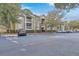 Exterior shot of apartment complex with ample parking, mature trees, and green landscaping at 1600 Long Grove Dr # 1621, Mount Pleasant, SC 29464