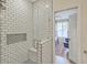 Tiled shower features a built-in seat and niche, with an open doorway to the bedroom at 1600 Long Grove Dr # 1621, Mount Pleasant, SC 29464
