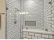 This pristine, tiled shower features a rainfall shower head, and a built-in shampoo niche at 1600 Long Grove Dr # 1621, Mount Pleasant, SC 29464