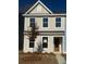Charming two-story home featuring tan siding, a gable roof, and well-placed windows at 163 Cantona Dr, Summerville, SC 29483