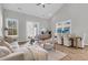 Bright living room with high ceilings, modern furnishings, and natural light from large windows at 163 Cantona Dr, Summerville, SC 29483