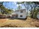 Exterior of home showing the screened porch and the spacious backyard and side yard at 1630 Balsam St, Charleston, SC 29407