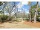 Expansive backyard featuring mature trees and a well-maintained lawn at 1630 Balsam St, Charleston, SC 29407