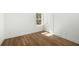 Bright bedroom boasts wood floors and a window with natural light at 1630 Balsam St, Charleston, SC 29407
