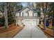 A beautiful two-story home boasts a classic design with a double garage and large driveway at 1630 Balsam St, Charleston, SC 29407