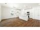Open kitchen features a bright island, modern appliances, and sleek white cabinetry at 1630 Balsam St, Charleston, SC 29407