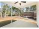 The screened porch offers beautiful view of the wooded backyard at 1630 Balsam St, Charleston, SC 29407