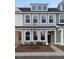 Charming townhome with light blue siding, white trim, and a well-maintained front yard at 167 Cantona Dr, Summerville, SC 29483