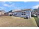 Exterior of the home with a grassy lawn, privacy fence and an installed air conditioning unit at 1941 Zonny Moss Dr, Johns Island, SC 29455