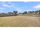 Large grassy backyard with pond view and wood fence around perimeter at 1941 Zonny Moss Dr, Johns Island, SC 29455
