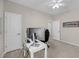 Neutral bedroom featuring a ceiling fan and a computer desk set against the back wall at 1941 Zonny Moss Dr, Johns Island, SC 29455