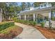 Charming community clubhouse with outdoor seating area and manicured landscaping at 1941 Zonny Moss Dr, Johns Island, SC 29455