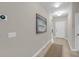 Inviting hallway featuring neutral paint, modern art, and a contemporary thermostat at 1941 Zonny Moss Dr, Johns Island, SC 29455