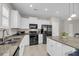 Modern kitchen featuring white cabinets, granite countertops, and stainless steel appliances at 1941 Zonny Moss Dr, Johns Island, SC 29455