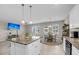Open kitchen and dining area with large island, granite countertops, and modern appliances at 1941 Zonny Moss Dr, Johns Island, SC 29455