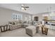 Inviting living room featuring neutral tones, a plush sectional sofa, and abundant natural light at 1941 Zonny Moss Dr, Johns Island, SC 29455