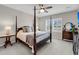 This spacious main bedroom features a four-poster bed and plenty of natural light from the windows at 1941 Zonny Moss Dr, Johns Island, SC 29455