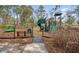 Community playground featuring swings, slides, and climbing structures for ' enjoyment at 1941 Zonny Moss Dr, Johns Island, SC 29455