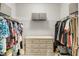 Organized walk-in closet with shelving, hanging space, and a dresser for ample storage at 1941 Zonny Moss Dr, Johns Island, SC 29455